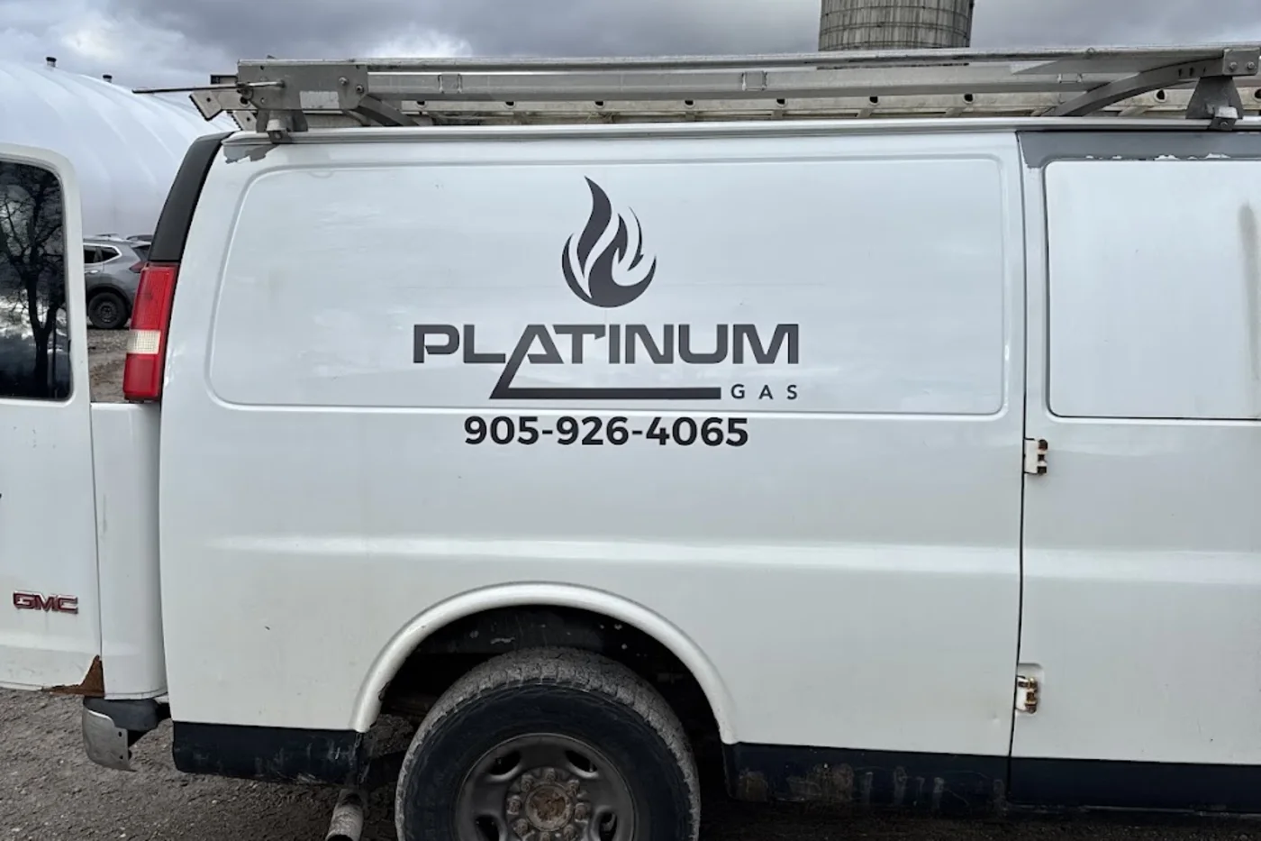 White Platinum Gas service van with the company logo and phone number - Platinum Gas White Platinum Gas service van with the company logo and phone number