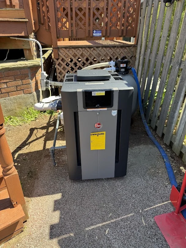 Reilly checking a gas pool heater with a homeowner
